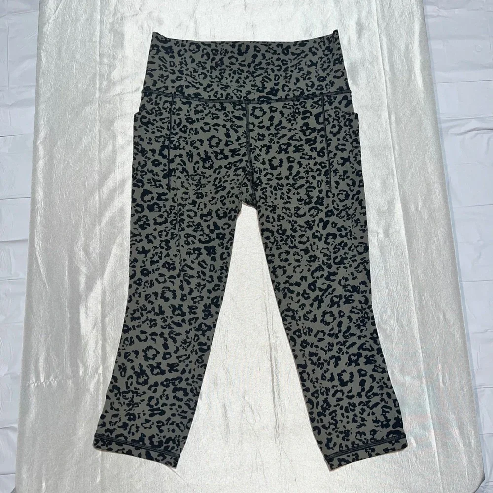 Athleta Salutation II Capri Leggings Olive Green Leopard Print Pockets Womens M